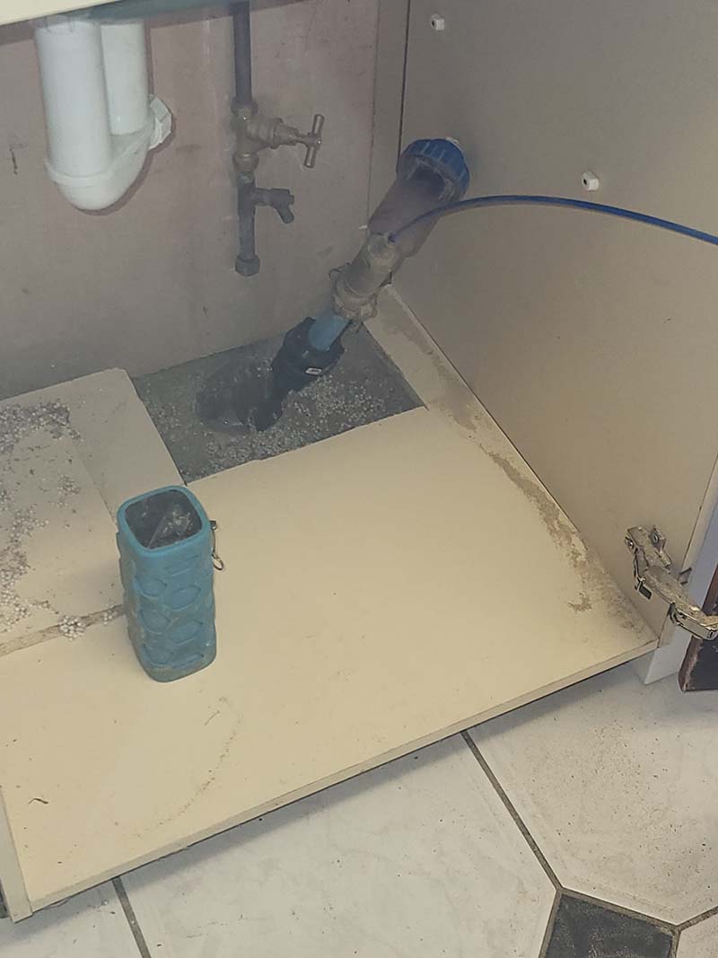 Fixing a pipe under the sink